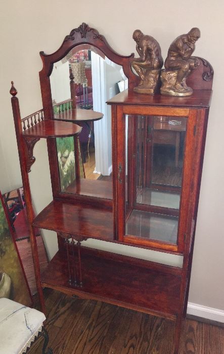 Antique etagere with beveled mirror; inside pane of glass missing on display case