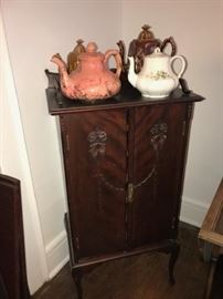 CHINA TEA POTS AND SHEET MUSIC CABINET