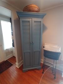 Blue painted luver door cupboard and large antique wooden bowl