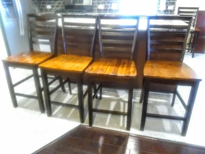 Four great Bar Stools plus one more in another area .