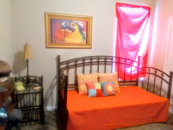Lovely colorful room with "Day-Bed" pull-out /up bottom for a mattress and lamp table.