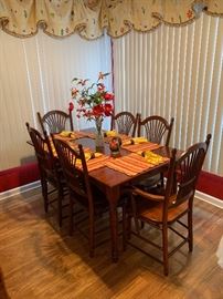 Beautiful cherry dining table with (6) chairs. There are two additional leaves-this table also has storage drawer on each end