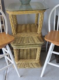 PAIR OF GLASS TOP WICKER SIDE TABLES.