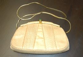 Judith Leiber snake skin evening bag with gemstone clasp