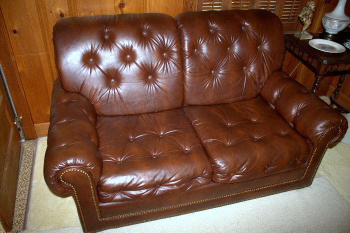 Brown vinyl loveseat