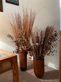 Wooden vases with decorative floral arrangements