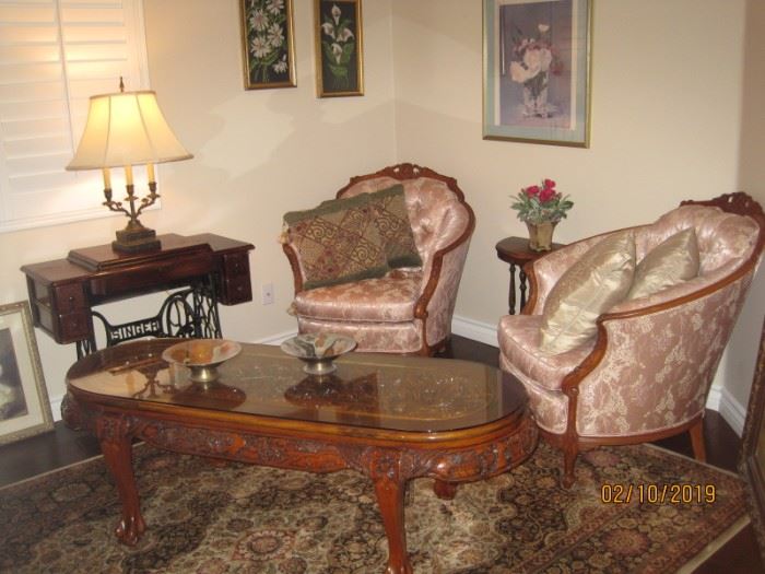 Pair of Rosewood Carved Frame Chinese Style Upholstered Chairs, Carved Chinese Style Rosewood Coffee table with glass top, Antique Singer Sewing Machine, Tapestry Framed Artwork, Decorator Lamp, Demi-lune side table. 