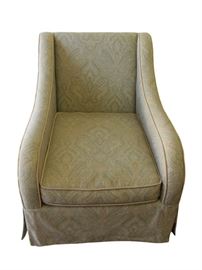 Paisley Arm Chair. Beautifully upholstered in a soft, neutral woven cotton paisley in a sage green color scheme with gold accents. Gold silk single welt detail throughout. Corner pleated tailored dress skirt. Zippers on cushion covers for easy removal and cleaning. Seat and back cushion made of polyurethane foam and wrapped in a removable case with zipper of sterilized waterfowl down and feathers. This chair sits deep, but very comfortable with the down’s giving characteristic.  A wonderful chair that has many years of enjoyment left!
Dimensions: 30.5”w x 38.5”d x 36”h • Seat=19”h • Arm=23.5”h
Condition: In perfect condition!
