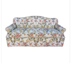 Scalamandre Design, Custom made Coraggio Sofa Beautifully upholstered in fabric by Coraggio called “Gandolfo” Made in Italy. From the moment you touch a Coraggio textile, you capture the fine art of the Italian Renaissance. This famous pattern features an exotic bird and peony motif in a soft color scheme of rose, gold, blue, sage green with brown accents on off-white background. The sofa features a subtle camel back with foam backing, a single polyurethane cushion wrapped in down (secures onto frame with hooks) with zipper for easy removal and cleaning and a dressmaker skirt. Sofa sits comfortably yet firmly without sinking or leaving an impression. The details in the upholstery of this sofa make it a true masterpiece!
Dimensions: 76”l x 38”d x 34”h • Seat=19”h x 23”d • Arm=25/26”h
