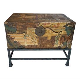 Antique hand painted pig skin Chinese wedding trunk surmounting an iron. The stand (new) is done in a mottled green, black and subtle gold finish giving it a feeling of having an antique patina with a stretcher connecting all legs and square bevelled feet. The scene depict courtesans in the royal palace in the Spring or Summer indicated by the cherry blossoms. Original engraved round brass latch on front and handles on either side. Interior is lined in a blue silk with exposed stitching. A beautiful piece at the end of a bed or for use as a coffee or accent table! W= 31" x20"D X 24" H