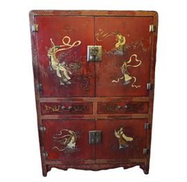 Antique Chinese red lacquer cabinet with gold gilt detail circa early 1900’s. The figures of women playing instruments and flower motifs on the piece’s sides have exquisite gilt that is almost iridescent. Subtle gold painted flower bouquets in vases are painted on the black finished interior doors. Brass hardware hinges and teardrop adornments on each panel along with brass dog latch for the upper cabinet. Upper and lower cabinet as well as two medium drawers for storage. Makes a great TV cabinet or a bar!

Dimensions: 38.25”w  x 22.75”d x 54”h (125 lbs)