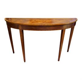 Henkel Harris Federal style inlaid mahogany console table featuring satinwood inlay on the tall tapered legs with sunburst inlay of holly, mahogany and maple on the top, inlaid bellflowers and holly pinstripe on upper middle of the legs with anigre and holly cuff I on the bottom. Swirly figured mahogany veneer top with bee’s wing satinwood border and edge banding. An elegant piece for your home used as a sofa table or against a wall! Henkel Harris has a wonderful history and is still regarded for its high clarity, durability, and overall quality. Made in the USA. 
	
Dimensions: 54”l x 16.25”d x 32”h (45 lbs.)
