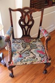 George III Mahogany Library Chair.                                     C-24/C-26
A George III mahogany library chair with carved downswept arms, pierced back and cabriole
legs with carved knees on ball and claw feet. The seat is covered with 18th century needlework.

English, circa 1765
Height: 39 inches (100 cms)
Width: 28 inches (71 cms)
Depth: 22 inches (56 cms)
