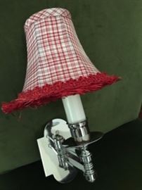 Pair of polished nickel wall sconces with Red and White shades, trimmed with fringe