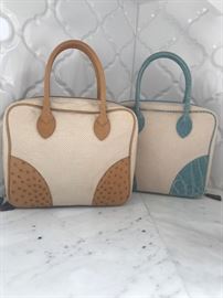 Lana Marks bags, cream canvas base with Almond ostrich corner tabs and handle (left) and Cream canvas with sky colored Alligator corner tabs and handle (right). Very Chic!
