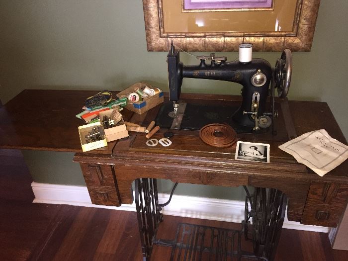 Fabulous old refurbished treadle sewing machine with all the parts and the book!