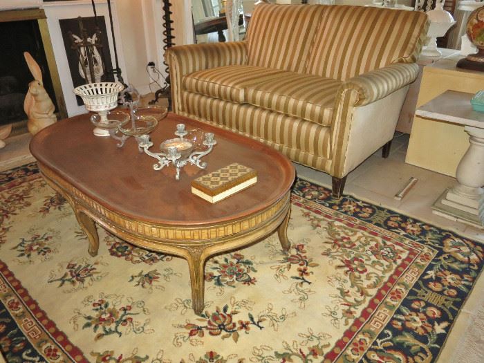 One of a Pair of Billy Haines-Style Loveseats with an Oval Mid-Century French Provincial-Style Coffee Table