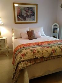 Full size bed with brass headboard