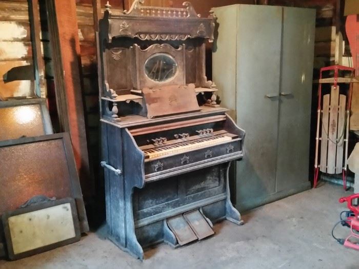 This antique pump organ was to be a restoration project.    It's old and dusty, but it still works.