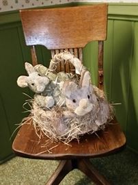 Two more Easter bunnies on an antique oak bankers swivel chair