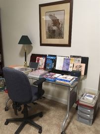 Glass Desk, Office Chair, Framed Print Lamp, Office Supplies.