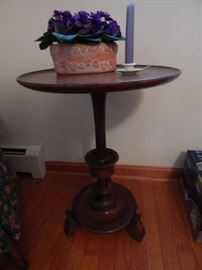 Turned wood accent table.