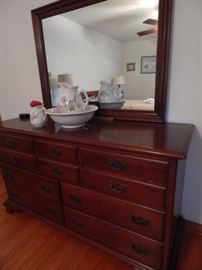 Nice size dresser with attached mirror. Cherry wood.