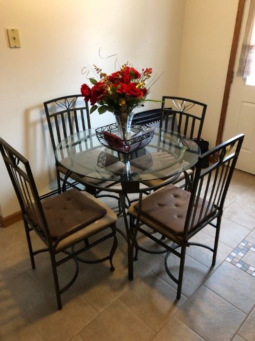 Kitchen Table with 4 chairs; brown seat seats. 