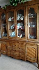 Beautiful china cabinet full of dishes and everything