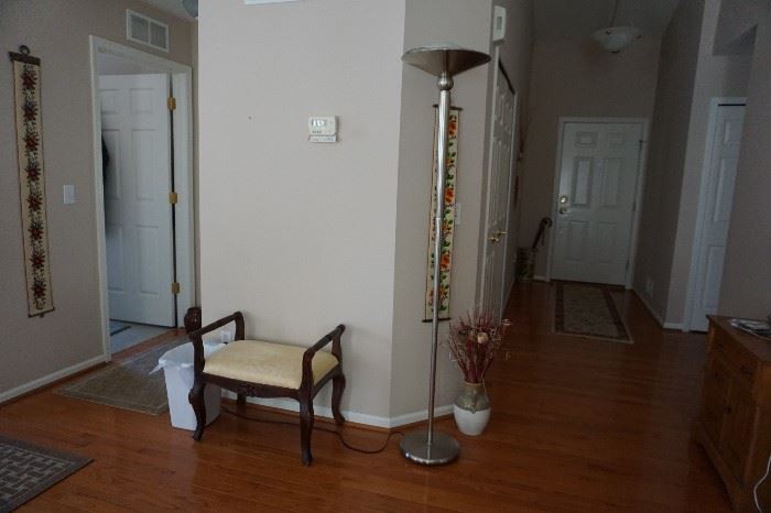 Mahogany stool, floor lamp dimmable, vase of flowers