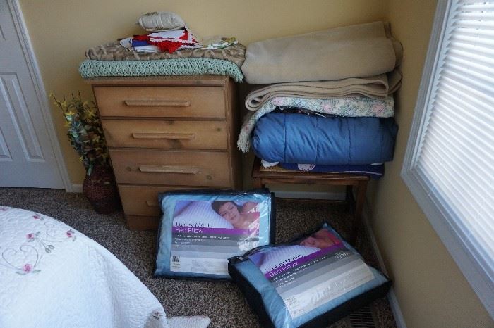 Linens, feather comforter, chest, pillows, blankets