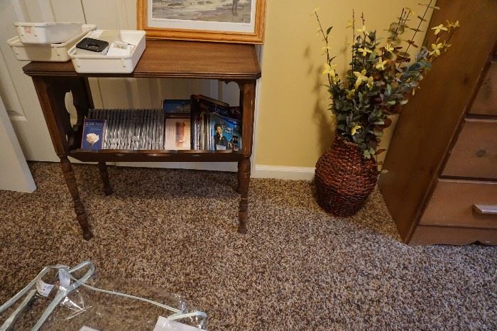 VD's, DVD's, wicker vase w/ flowers