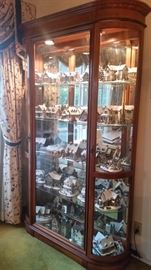 Nice display cabinet.   Hawthorne Village "Thomas Kinkade" Village.  Some Dept. 56.