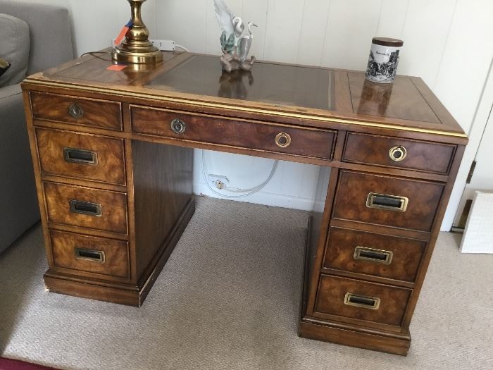 Burled wood desk with brass handles