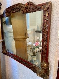 Antique mirror with red detail