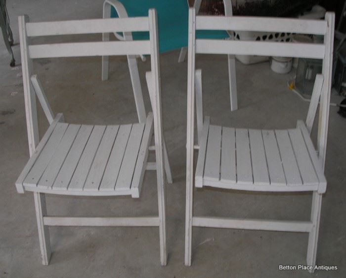 Two wooden fold up chairs