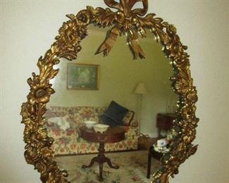 Ornate metal framed mirror