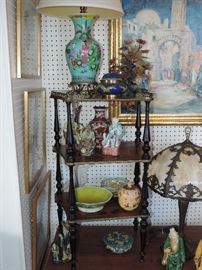 Music stand shown full of knick-knacks and Asian Smalls 