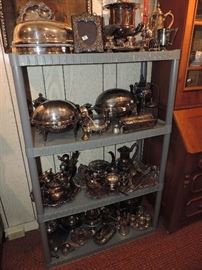 an entire SHELF loaded with silver plate and some pieces are FUN including veggie domes and meat domes... 