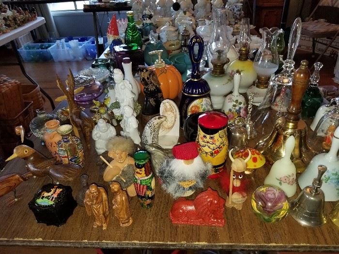Antique oil lamps, Russian nesting doll and other travel souvenirs, bell collection, etc,