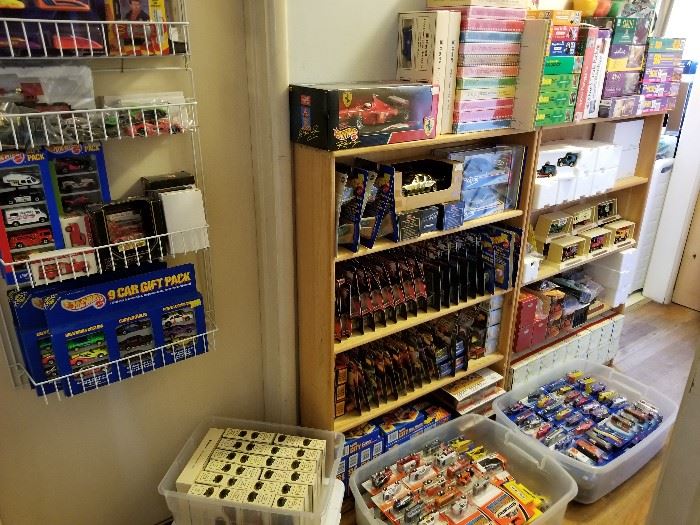 Hot Wheels, Matchbox, Chevron, and other vintage car and truck replicas.
