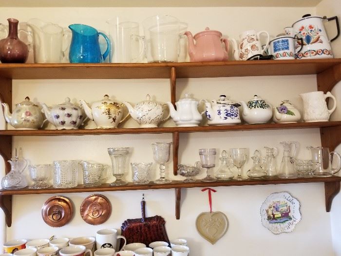 Antique copper lids, vintage teapots, pitchers, and coffee pots, vintage EAPG glass.