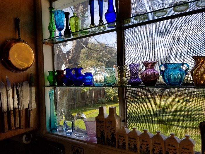 Fenton and other glass vases, vintage blue delft oil, vinegar and spice bottles from Germany.