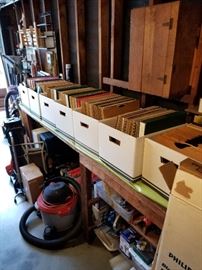 Vintage LPs / vinyl records (33's and 78's) from three generations, shop vacs, and garden tools.