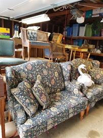 Blue floral upholstered love seats, miscellaneous chairs and furniture; Rubbermaid Roughneck totes and Sterilite file and storage containers; Stuffed Odette swan from Barbie's Swan Lake,