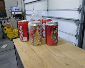 Five Coca Cola Piggy BanksOne with a suprise insi ...