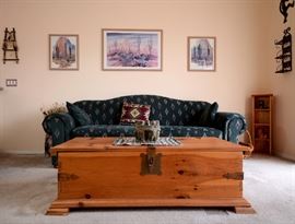 Fabulous wooden trunk used for a coffee table here.