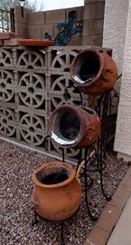 Set of 3 rustic outdoor pots with tiered stand for sale.