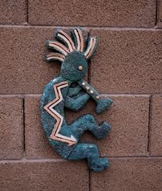Kokopellis throughout the backyard for sale.