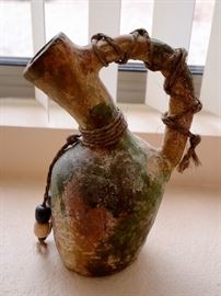 Unusual primitive looking sculpted pottery for sale.